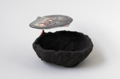 Humus. Black clay, glaze/porcelain/pigments, decals. 2022. 24 × 20 × 11cm. Sold.